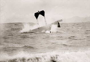 airplane of pilot and daredevil Hugh Armstrong Robinson (1881-1963) making a crash landing on water near Nice, France, 1912. 1912