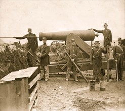 Loading 24-pdr. siege gun on wooden barbette  1863