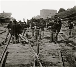 Atlanta, Georgia. Sherman's men tearing up railroad track 1864