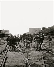 Atlanta, Georgia. Sherman's men tearing up railroad track 1864