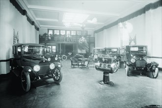 Automobiles on Display in Tent Under American Flag Banners 1921