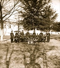 Band group seated behind their instruments 1865