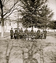 Band group seated behind their instruments 1863