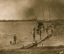 Beaufort, South Carolina. Erecting pontoon bridge across Port Royal River 1862