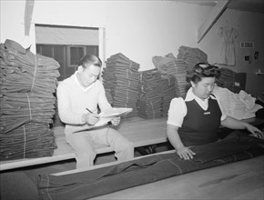 Bert K. Miura and Toshiko Kadonada, bundling and shipping,  1943
