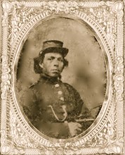 Black soldier seated with pistol in hand, watch chain in pocket 1865