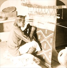 Blanket weaving - a Hopi Indian at work, Wolpei (i.e., Walpi), Arizona 1903