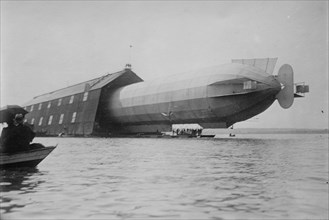 Blimp, Zeppelin No. 3, in shed, seen from water