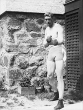 Bombardier Billy Wells, English boxer, preparing in Rye, N.Y., for fight with Al Panzer 1912