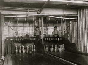Bowling Alleys, small boys employed here. Work until midnight. 1910