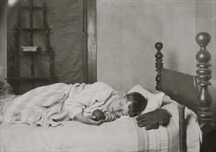 Boy Asleep in his bed with a baseball & Glove 1924