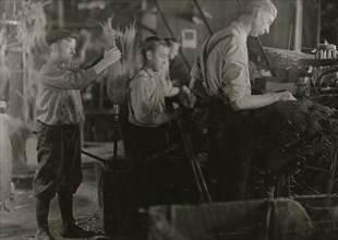 Boys assisting at the Broom Machines. S. W. Brown Mfg. Co.,. 1908