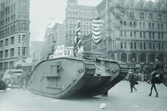 British tank sporting an American Flag tracks down Fifth Avenue, New York 1917