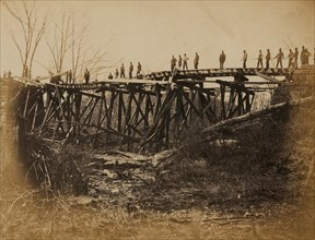 Building military railroad truss bridge across Bull Run, April, 1865 1863