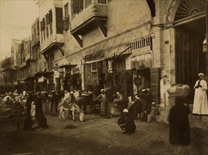 Busy commercial street in Cairo. 1880