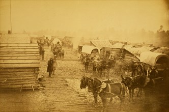 Camp of the Union forces at Centreville, Virginia, showing soldiers, log buildings, horses and wagons, during winter of 1861-1862 1861