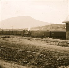 Chattanooga, Tenn. U.S. military train at depot; Lookout Mountain in background 1864