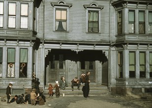 Children with adult in the tenement district, Brockton, Massachusetts 1910