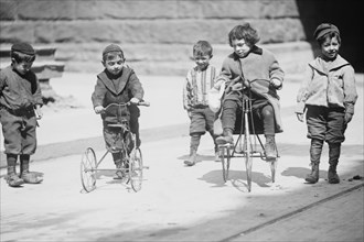 Children with Tricycles Playing in Manhattan Street 1909