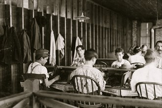 Cigar makers in factory of Filogamo & Alvarez, Tampa, Fla. Work was slack. 1909