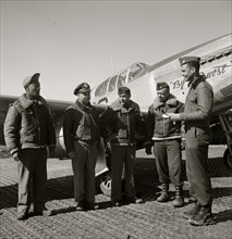 Col. Benjamin O. Davis at Ramitelli, Italy, March, 1945, presenting war bond for best kept A/C 1945