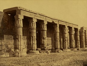 Colonnade on side of temple in Karnak. 1880