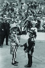 Costumed Child dressed as Uncle Sam welcomes another toddler representing the Italian community of the United States for an Italy-American Friendship Even held in New York City