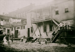 Cottage Street hovels down by the river in Easthampton, Mass., in which a great deal of home work is done on suspenders 1912