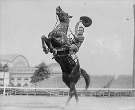 Cowboy Rides Rearing Horse & Waves his Stetson Hat 1923