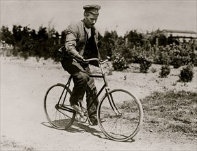 Crippled German soldier on bike
