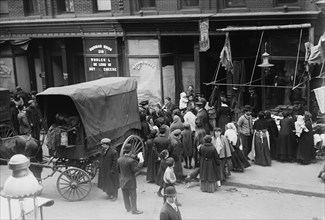 Crowd gathered in front of butcher shop during meat riot, New York 1910