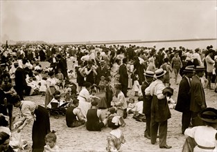 Crowds on the beach at Coney Island, New York