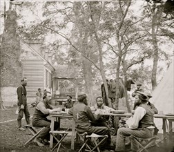 Cumberland Landing, Va. Secret Service men at Foller's House; Black seated as an equal at a table dining 1862
