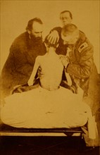 Doctors examining a Federal prisoner returned from prison 1863