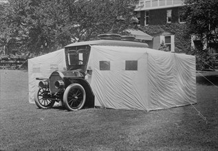 DuPont, Owner of General Motors Introduces Car that Molts into a Camper With Tents 1914