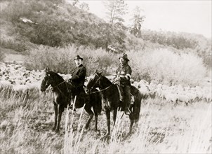 Edd Ladd, full-blood Apache Indian, of the Jicarilla Reservation, New Mexico, with Indian Commissioner Cato Sells, on horseback 1920