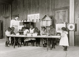 Children, in kindergarten, learning washing and ironing  1899