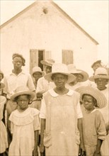 Eliz Austin and children with Cleveland Simmons, Old Bight, Cat Island 1935
