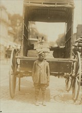 Elwood Palmer Cooper  Helper on miller's wagon.  1910