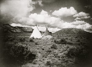 Two Apache Indian teepees in a hilly landscape in Arizona 1909