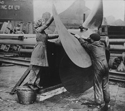 English Workers labor over a ship's Propeller at Shipyard 1918