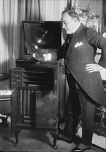 Enrico Caruso Peruses a Disk if his Singing by a Phonograph
