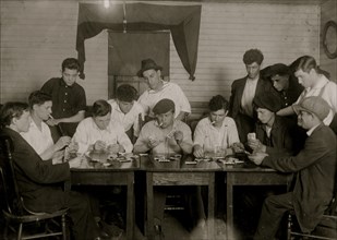 Evening recreation of the "Young Holy Ghosters" - Ages 15 - 25, average is 18 - all mill workers - all Portuguese.  1916