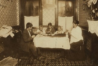 Italian Family makes flowers in their tenement apartment 1911