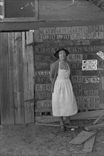 Farm woman beside her barn door 1938