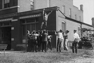 Firefighter Jumps into Net Held by Fellow Firemen 1920