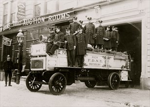 Firemen posed on fire engine, New York City 1914