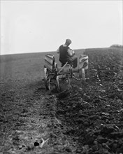 Ford Tractor plowing field 1925