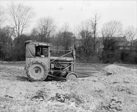 Ford Tractor with Drag line pulls earth