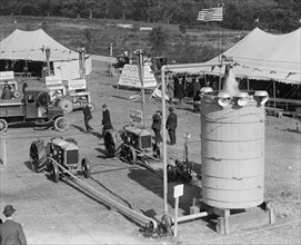 Fordson Tractors on Display at an open air exhibition with tents and a jerkwater 1918